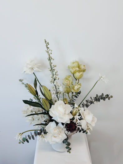 White and green flowers in a pot